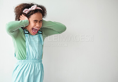 Buy stock photo Scream, studio and child cover ears by mockup space for sound with ADHD, scared or autism spectrum. Neurodivergent, shout and girl kid with noise blocking for sensory sensitivity by white background.