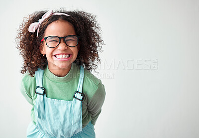 Buy stock photo Excited, glasses and portrait of child in studio with mockup space for prize, deal or giveaway. Shy, happy and cute girl kid from Mexico with promotion, winner or vision isolated by white background.