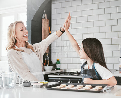 Buy stock photo High five, kid and baking with mom for development, bonding and teaching of skills to bake in the kitchen. Cooking, cook and motivation of mother and daughter in the family home for culinary skills 