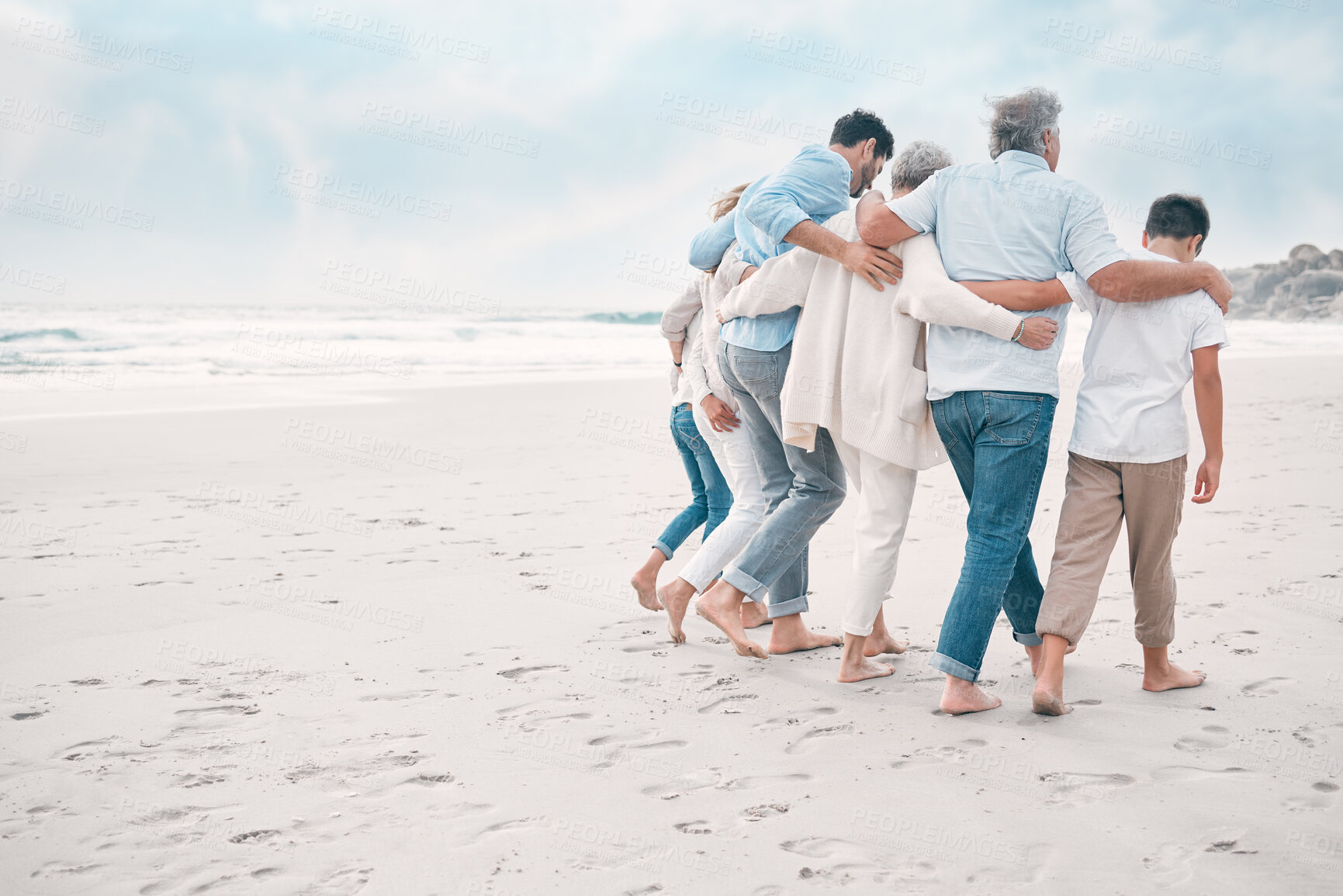 Buy stock photo Back, hug and walking with family on beach together for holiday, travel or vacation in summer. Sand, sky or space with senior people, parents and children at ocean or sea for tropical getaway