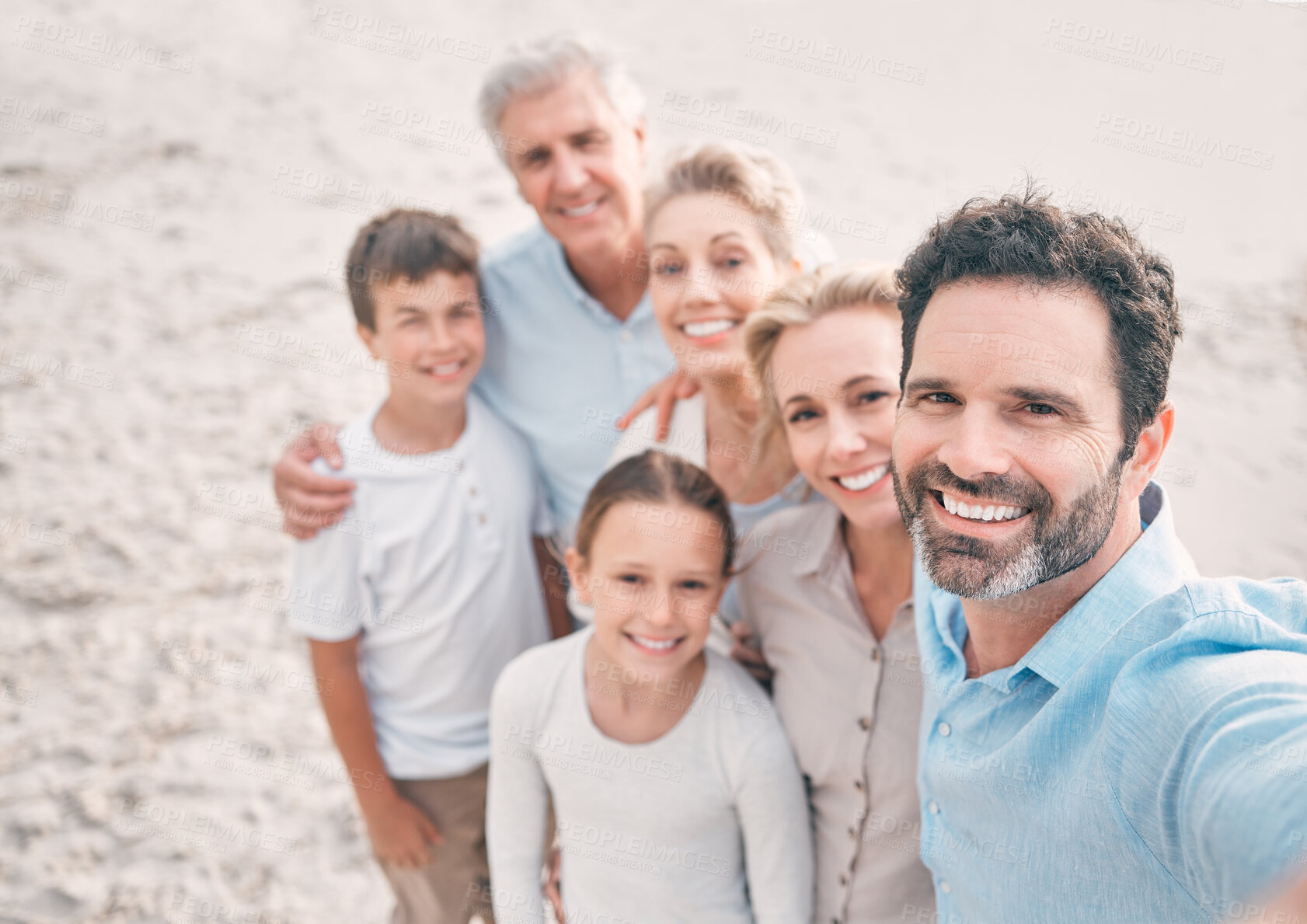 Buy stock photo Love, selfie and smile with family on beach together for holiday, travel or vacation. Hug, portrait or summer with senior people, parents and sibling children outdoor for bonding, picture or wellness