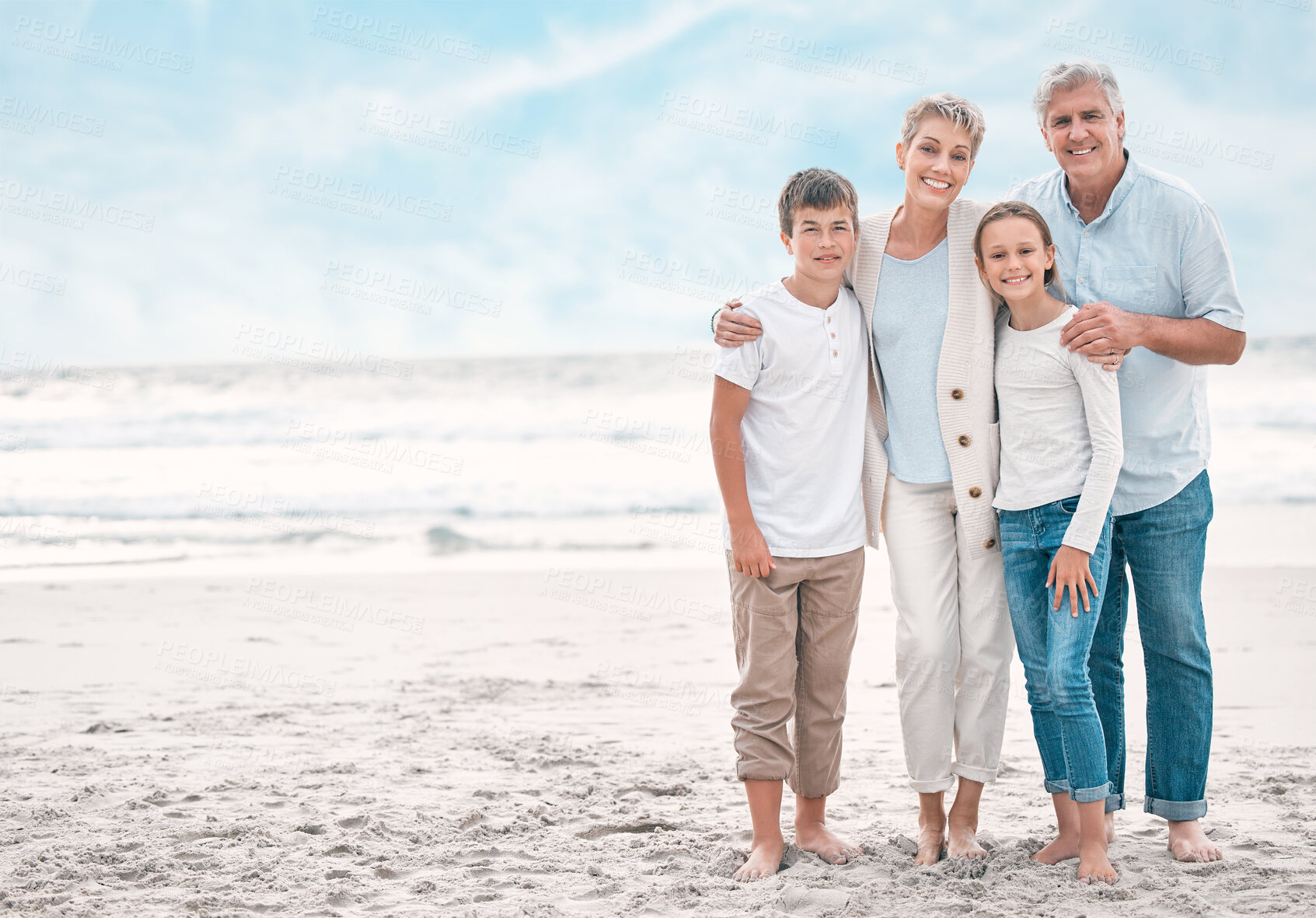 Buy stock photo Portrait of boy, girl and grandparents on beach together for holiday, travel or vacation. Hug, love or smile with senior people, brother and sister children embracing on mockup space for bonding