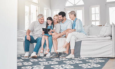 Buy stock photo Family, children and tablet with parents, grandparents and girl on a sofa in the living room of their home together. Love, kids and technology with a woman, man and daughter at relatives for a visit