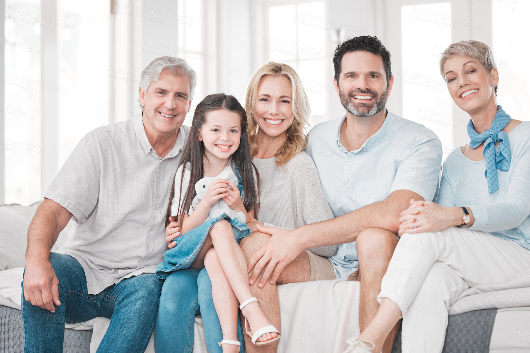 Buy stock photo Big family, love and happy smile on a home living room sofa spending quality time together. Portrait of parents, elderly people and girl child with happiness smiling on a family home lounge couch