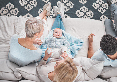 Buy stock photo Bonding, above and baby with family on the sofa in the living room of their house with care. Love, happy and parents with grandmother and portrait of a child playing with affection on the couch