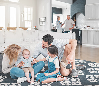 Buy stock photo Happy, living room and parents relaxing with their children bonding and playing together in the family home. House, mother and father resting on floor with their kids with love, care and happiness.