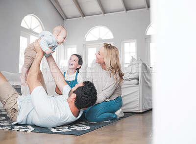 Buy stock photo Family, children and fun with a mother, father and daughter siblings playing together on the living room floor. Love, kids and playful with a man, woman and girl bonding in the lounge of their home