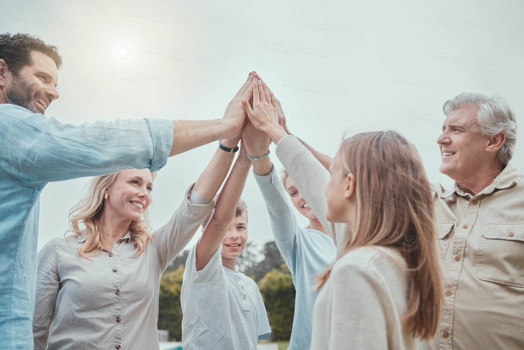 Buy stock photo Celebration, high five and success with family in garden of new home together for property investment. Huddle, motivation or support with old people, parents and kids outdoor for real estate growth