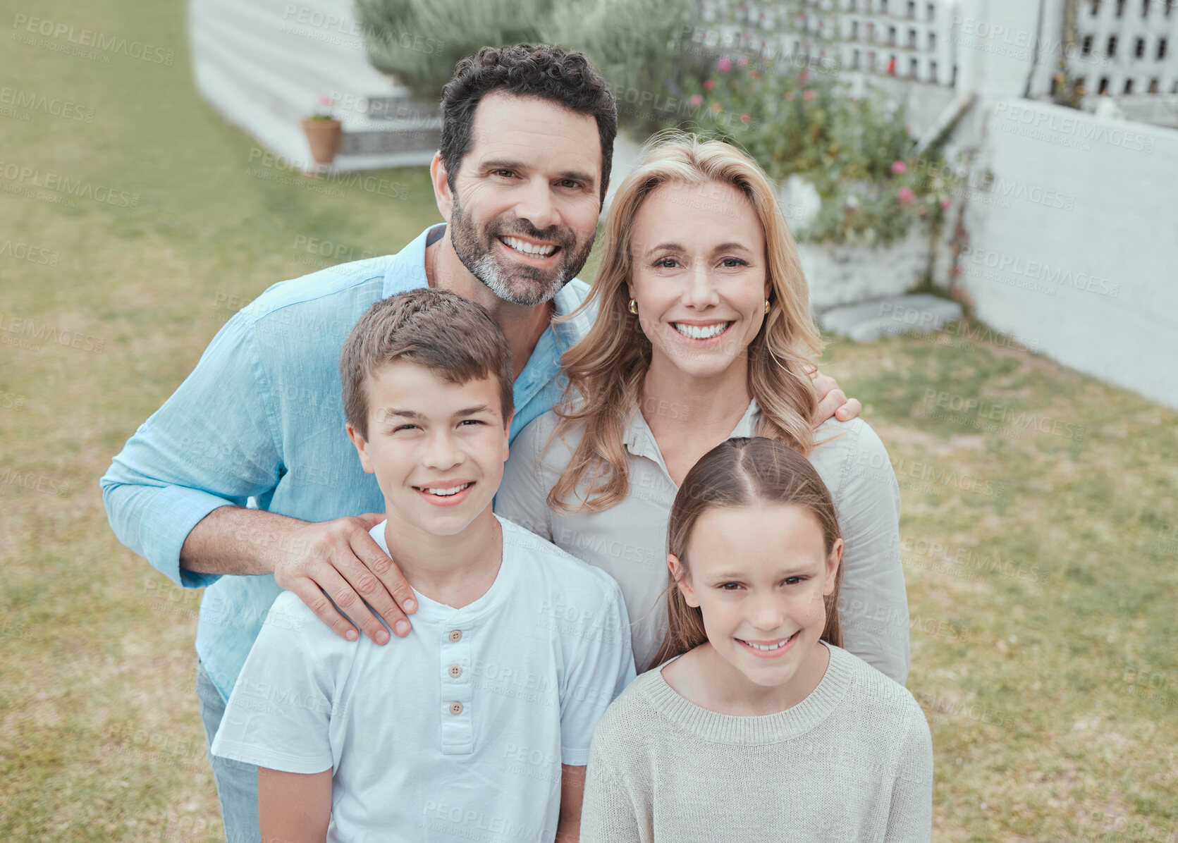 Buy stock photo Family, portrait and smile at home for bonding, relax and support together with face on weekend. Parents, happy and children at backyard of house for care, leisure and love with fun break in Germany