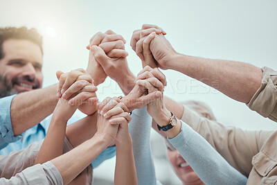 Buy stock photo Shot of a family holding hands at home