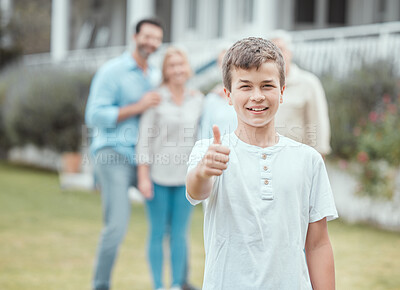 Buy stock photo Shot of a little boy showing a thumbs up in the garden at home