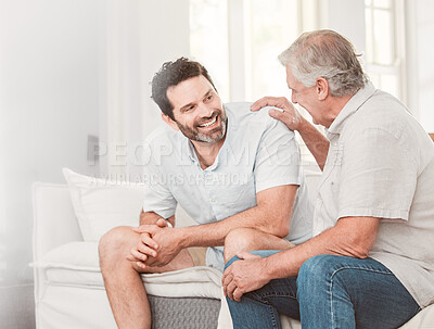 Buy stock photo Comfort, happy man and senior father in home for conversation, relax or family bonding for love. Smile, adult son and mature parent in lounge for support, connection and story of generations together