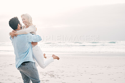 Buy stock photo Beach, love and man carry woman on holiday, vacation and romantic weekend for anniversary. Mockup space, marriage and happy mature couple spin in air for bonding, quality time and romance by ocean