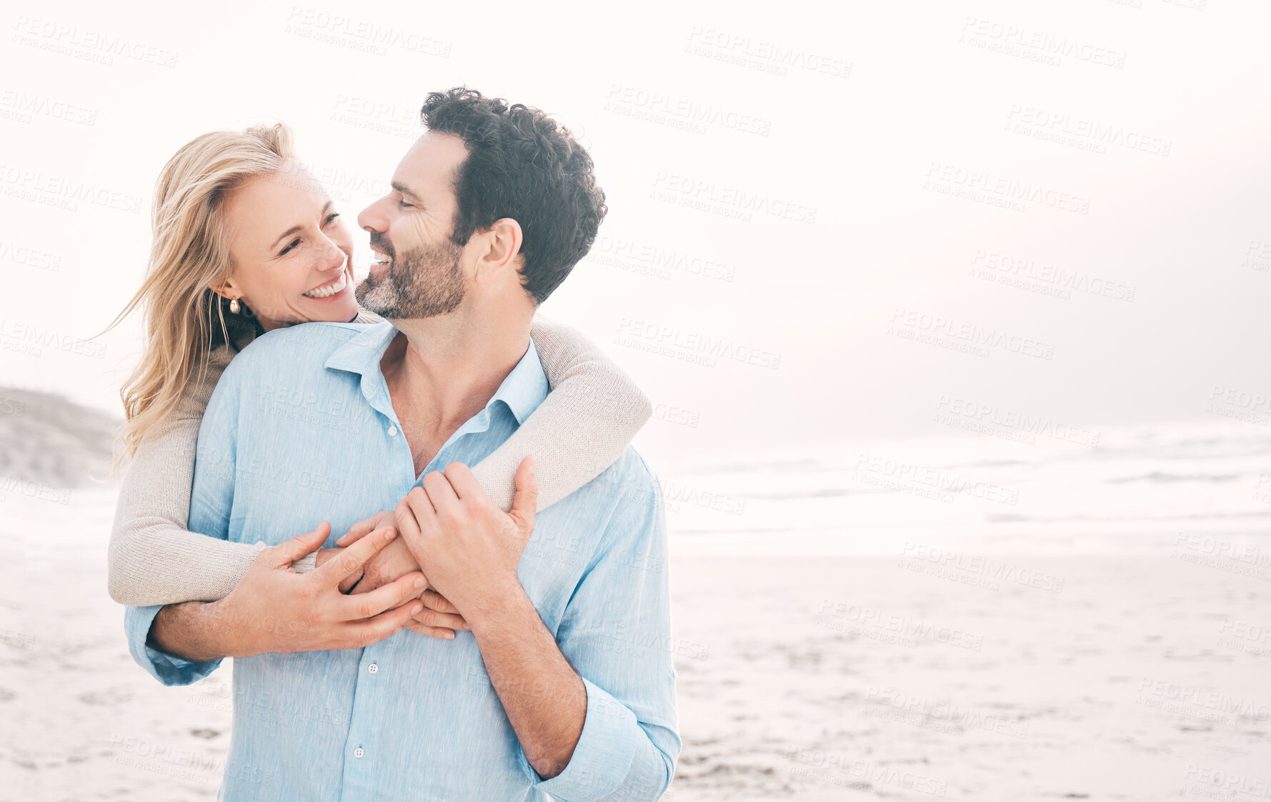 Buy stock photo Travel, happy and couple hug at beach for holiday, vacation and romantic weekend for anniversary. Love mockup, marriage and mature man hugging woman for bonding and happiness by ocean with space