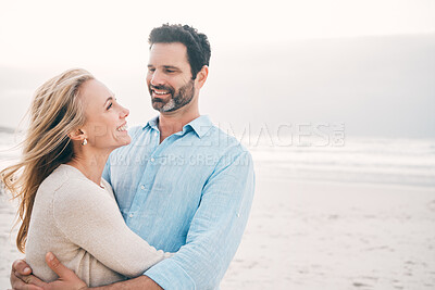 Buy stock photo Beach, hug and couple with smile in nature on holiday, vacation and romantic weekend for anniversary. Love, marriage and happy mature man hugging woman for bonding, quality time and relax by ocean