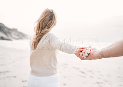 Buy stock photo Holding hands, beach and couple with love, closeup and romance with happiness, coastline and care. People, seaside and man with woman, ocean and dating with adventure, travel and bonding together