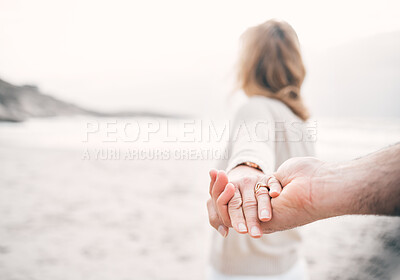 Buy stock photo Holding hands, beach and couple with care, closeup and romance with happiness, coastline and travel. People, seaside and man with woman, ocean and dating with adventure, love and bonding together