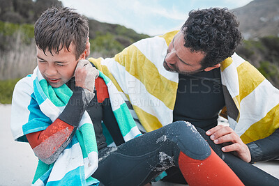 Buy stock photo Injury, dad or child surfer on beach for help, accident or exercise emergency in outdoor adventure. Checking, father and son at ocean for surfing, training or holiday together with hurt ear or pain