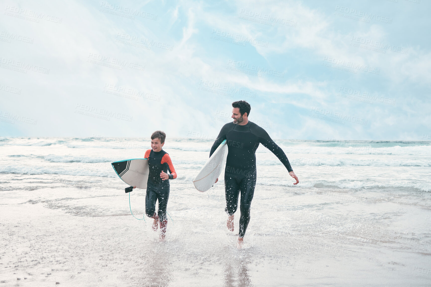 Buy stock photo Surfboard, dad and child at sea for running, sports or exercise for water or bonding adventure. Surfer, father and son at beach for surfing, teaching and learning together for love, support or growth