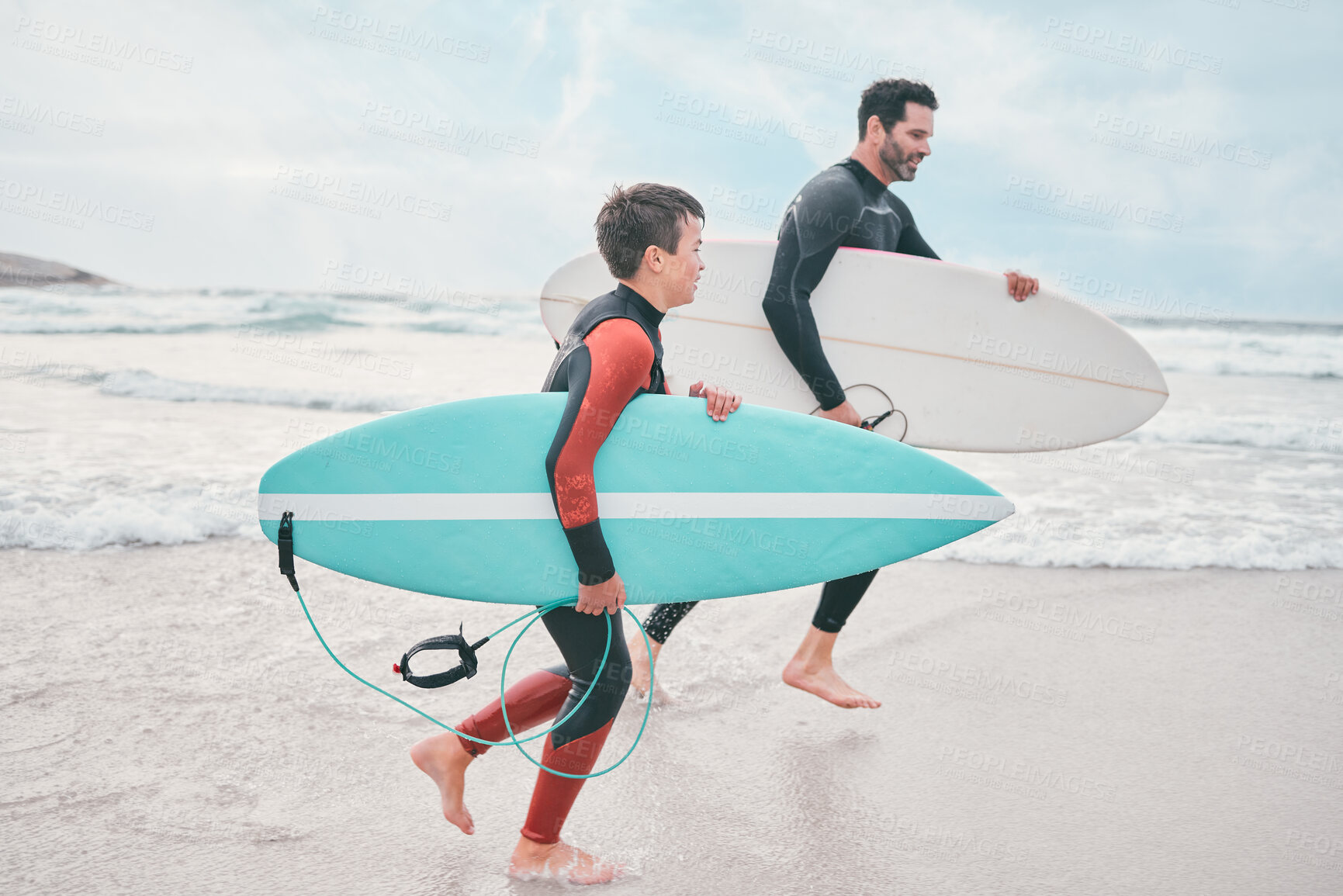 Buy stock photo Surfboard, dad and child on beach for running, sports or exercise on outdoor bonding adventure. Surfer, father and son at ocean for surfing, teaching and learning together for love, support or growth