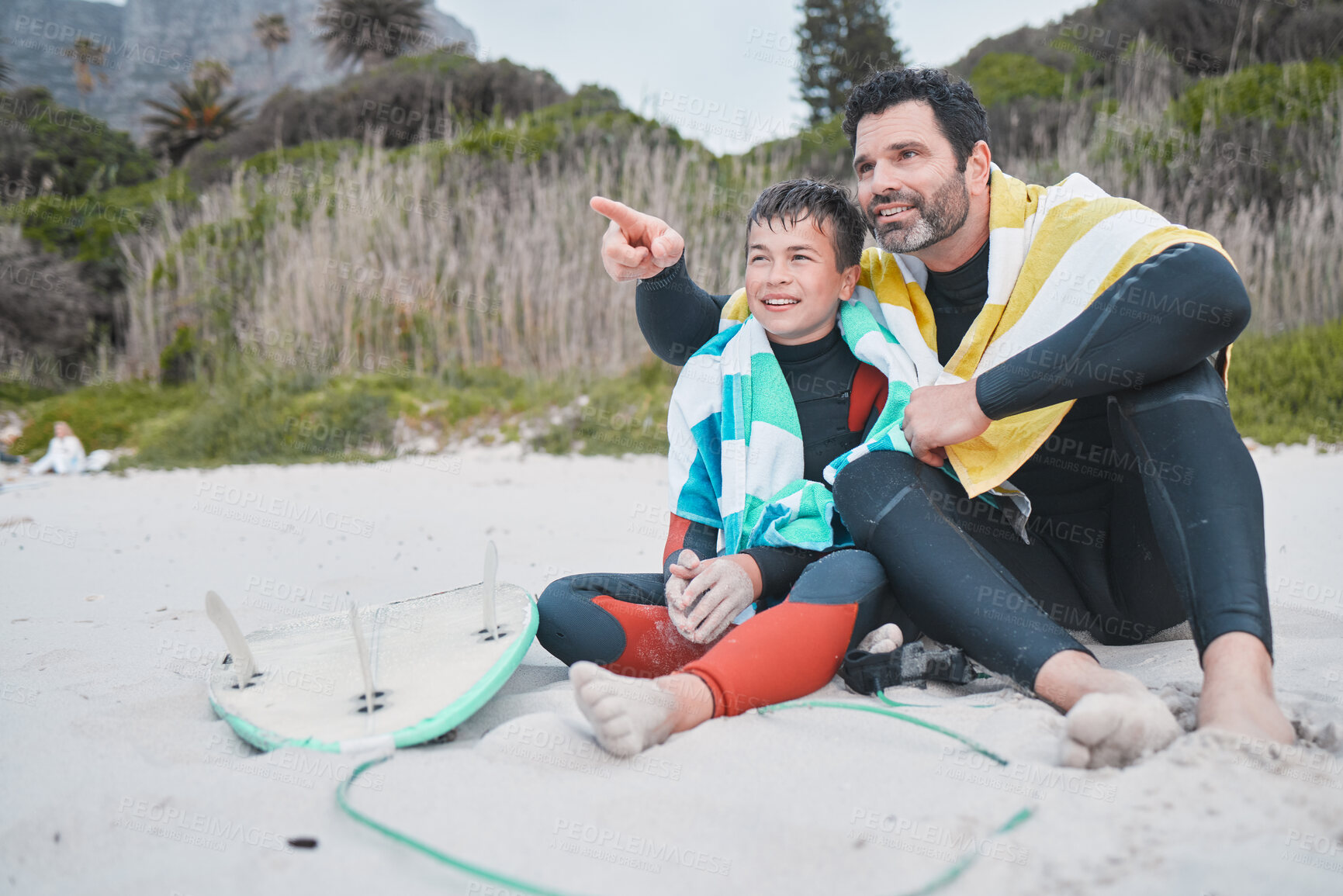 Buy stock photo View, dad and child surfer on beach for pointing, sports or exercise on outdoor bonding adventure. Looking, father and son at ocean for surfing, teaching and learning together with support and love