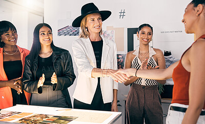 Buy stock photo Shot of a group of businesswomen welcoming a new member to the team