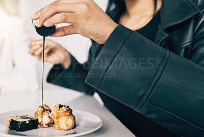 Buy stock photo Sushi, hand of person or pour soy sauce on pieces for flavor, taste or gourmet meal in office. Woman, teriyaki or Japanese cuisine at table for takeaway food or high quality catering in business