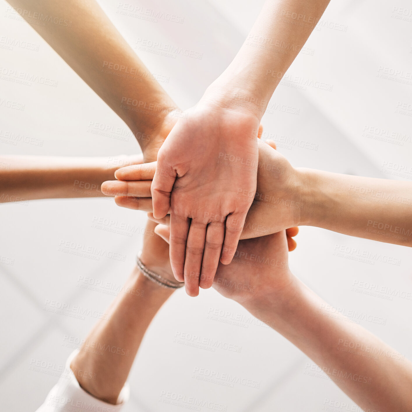 Buy stock photo Hands stacked, teamwork and group of people in support, collaboration goals and community or solidarity from below. Circle, women and team work, faith or together sign isolated on a white background