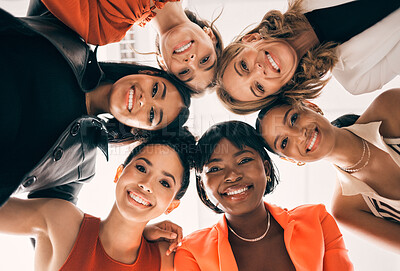 Buy stock photo Diversity, circle and low angle portrait of businesswomen in a huddle at a team building meeting. Happy, confidence and group of professional female employees in collaboration bonding in the office.