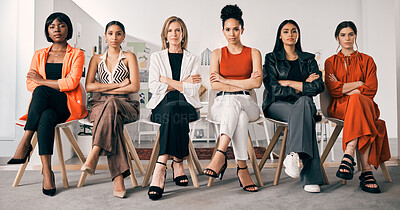 Buy stock photo Shot of a group of businesswomen sitting in a row in an office at work