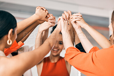Buy stock photo Shot of a group of businesswomen holding hands at work