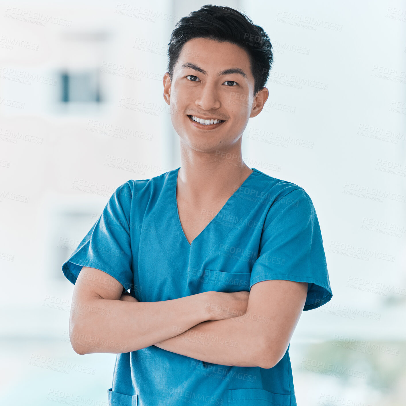 Buy stock photo Portrait, nurse and happy Asian man with arms crossed for healthcare career, pride or service in hospital. Face, smile and confident medical professional, employee and expert surgeon working in Japan