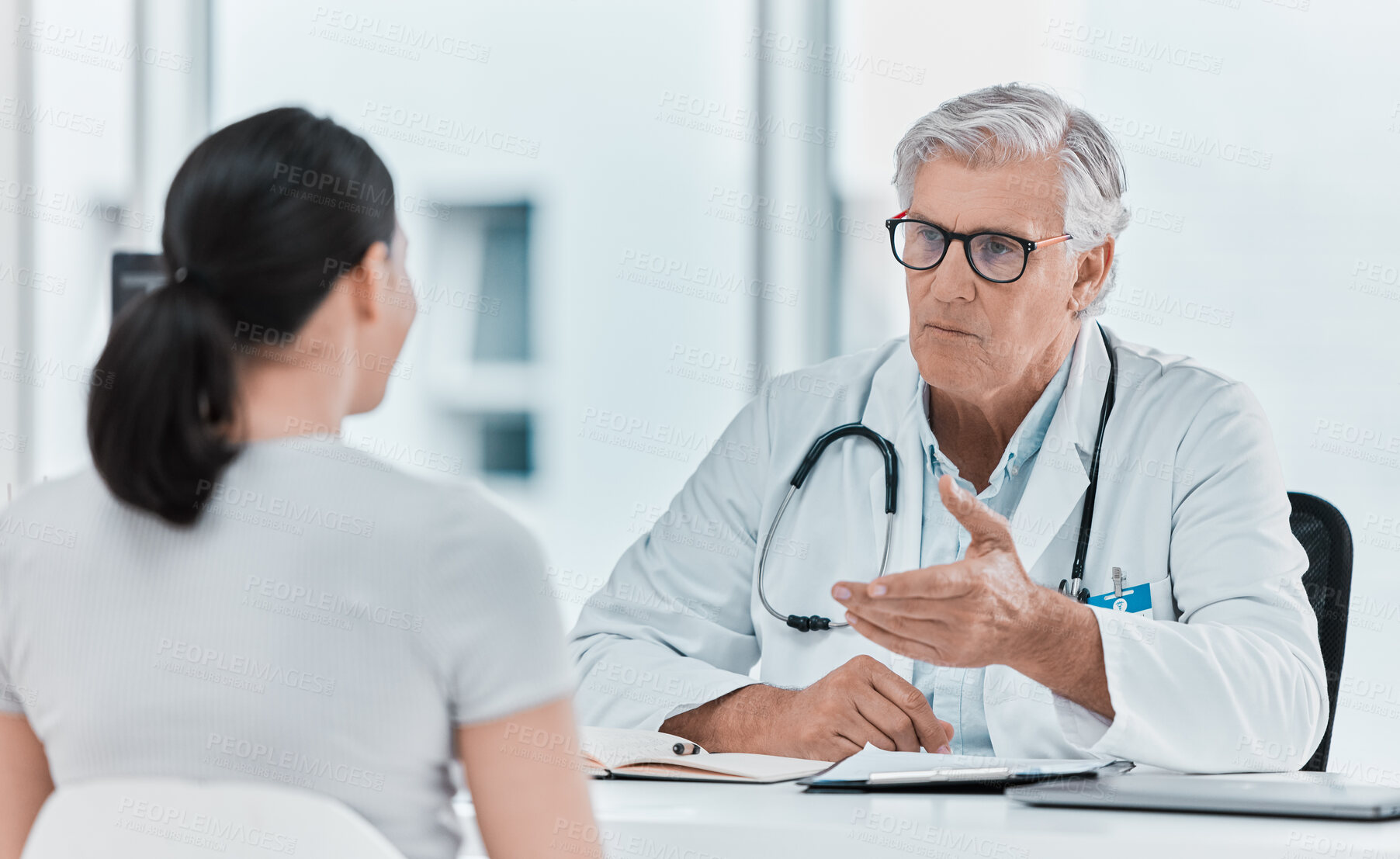 Buy stock photo Mature doctor, patient and consultation in office clinic for healthcare, checkup or advice. Medical professional, woman and conversation for help, exam and explain treatment in hospital appointment