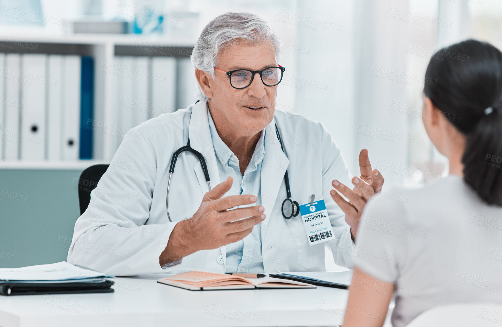 Buy stock photo Mature doctor, patient and consultation in clinic for healthcare, checkup results and advice. Medical professional, man and conversation for help, exam and explain treatment in hospital appointment