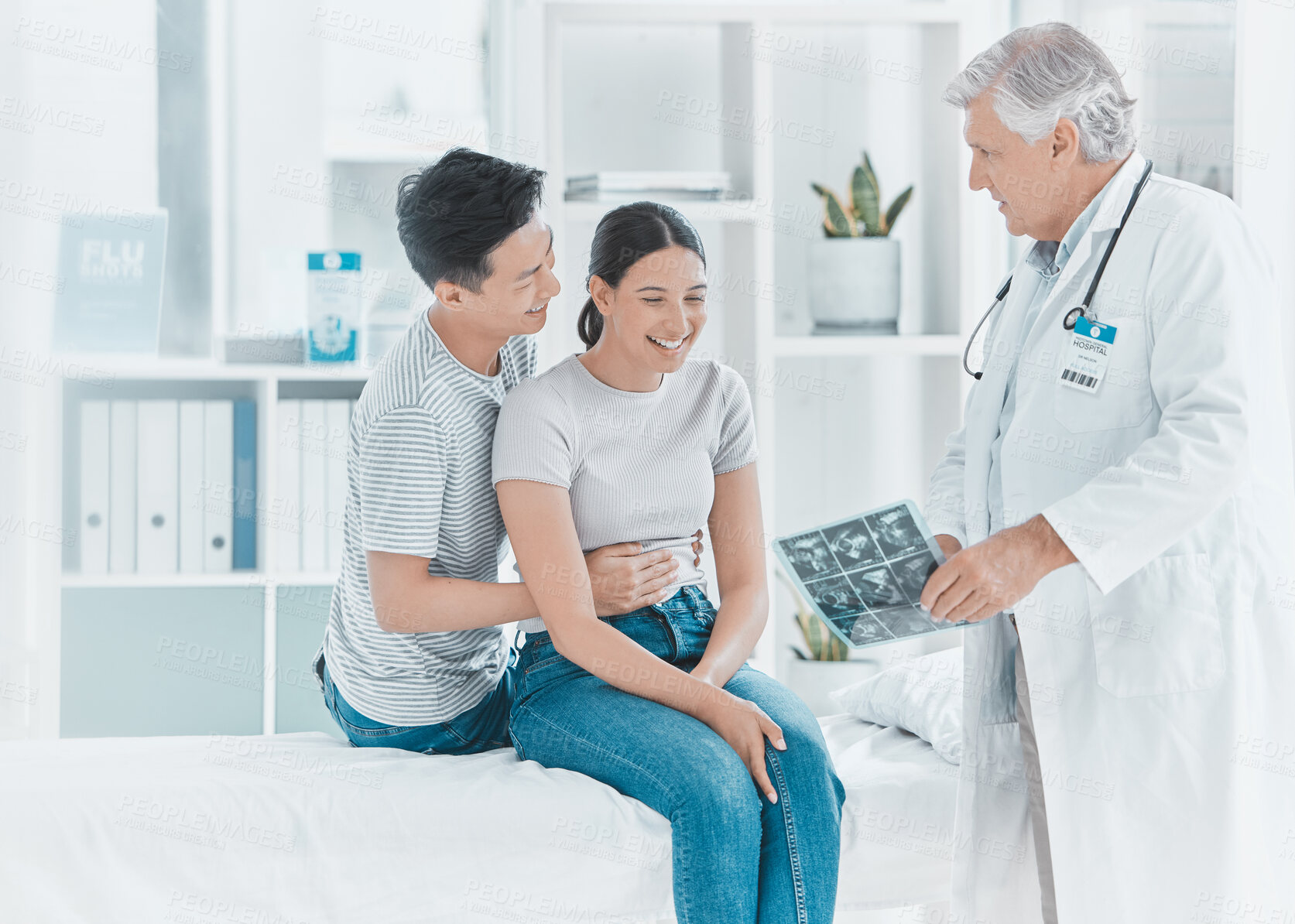 Buy stock photo Couple, doctor and pregnancy scan at clinic, ultrasound diagnosis and excited for ivf success. Mature man, gynecologist and plan with people for maternity progress, exam and discuss utero healthcare