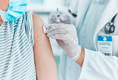 Buy stock photo Shot of a doctor giving his patient an injection