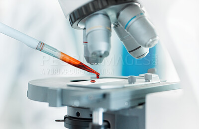 Buy stock photo Closeup shot of an unrecognisable scientist using a microscope in a lab
