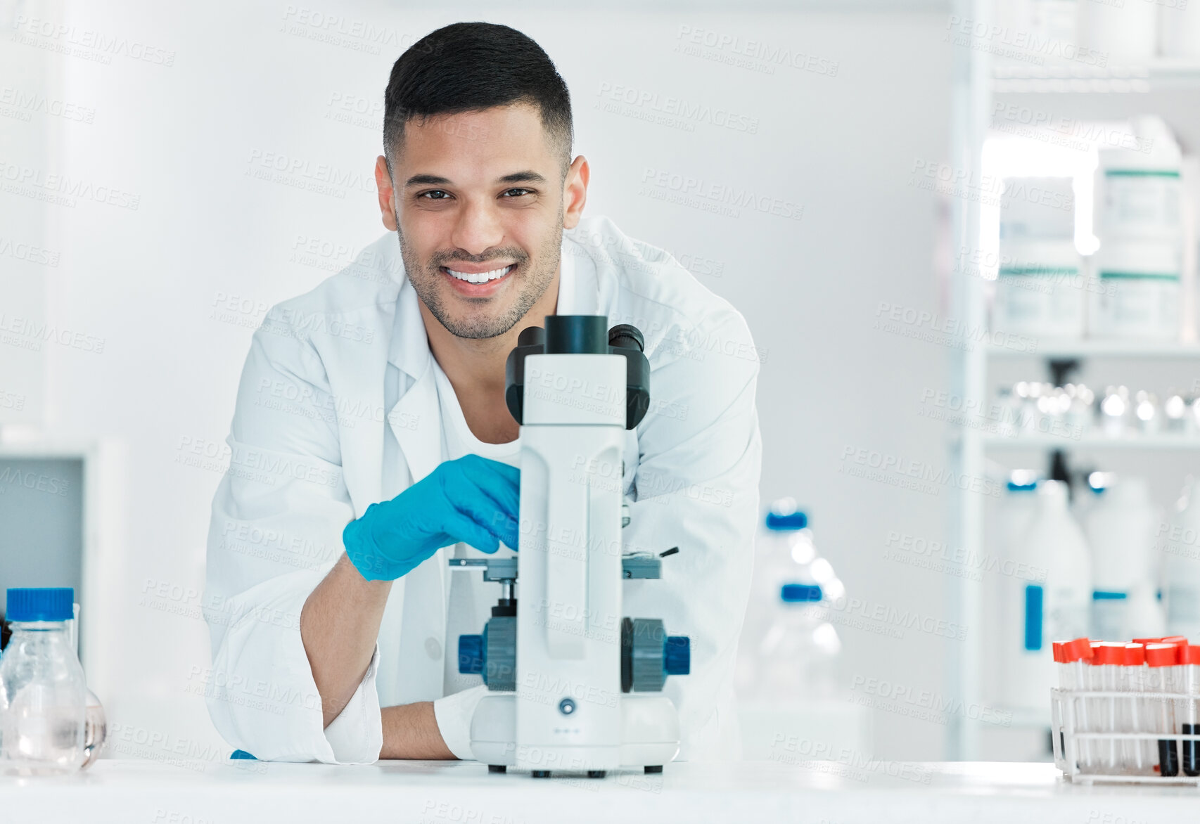 Buy stock photo Microscope, happy man and portrait of scientist for science breakthrough, clinical trial or discovery. Biotechnology, medical test or vaccine research in laboratory with confidence for cure in Turkey