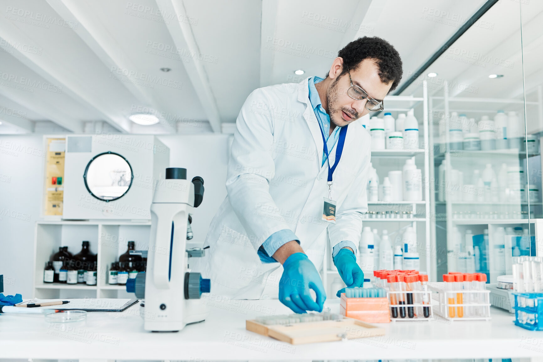 Buy stock photo Man, researcher and blood test in lab for medical analysis, dna experiment and engineering solution. Scientist, liquid sample and healthcare for science, bacteria assessment and vaccine investigation