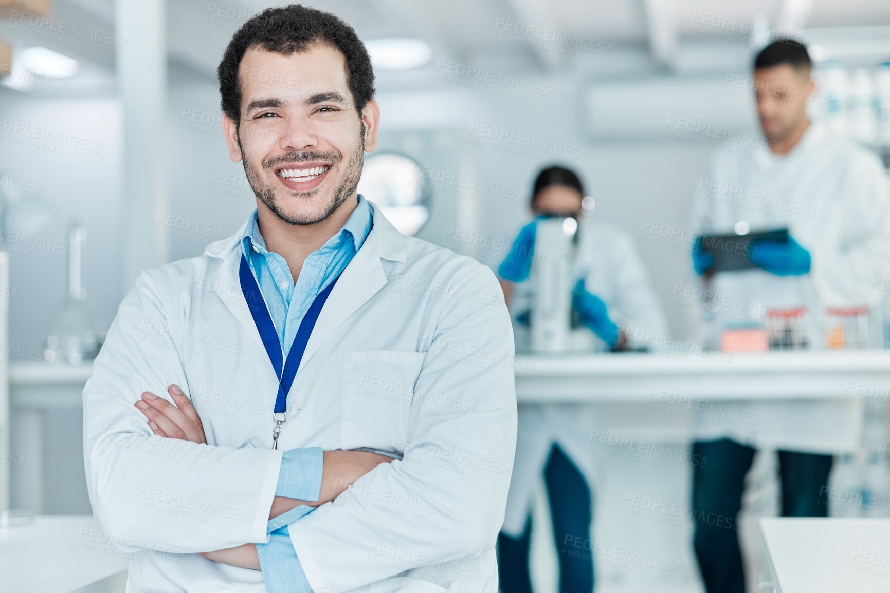 Buy stock photo Man, portrait and confident in lab for science, chemical engineering or pharma production. Happy, scientist and arms crossed in research facility for career, medical knowledge or medicine development