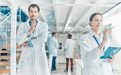 Buy stock photo Shot of two young scientists brainstorming with notes on a glass screen in a lab