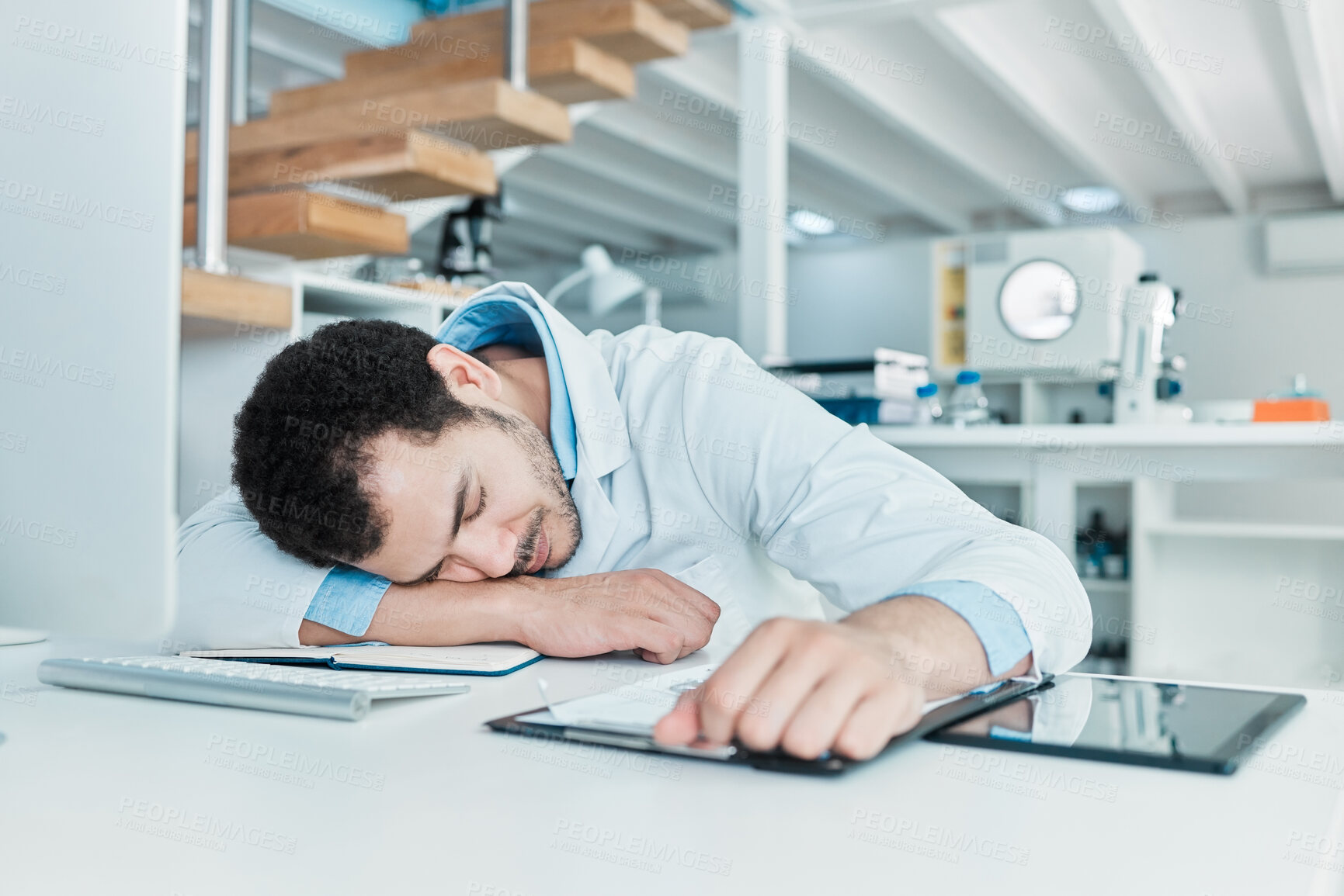 Buy stock photo Sleeping, science and tired with man in laboratory for medicine research, antibiotic resistance news and deadline. Healthcare, medical and fatigue with person for emergency, frustrated and accident