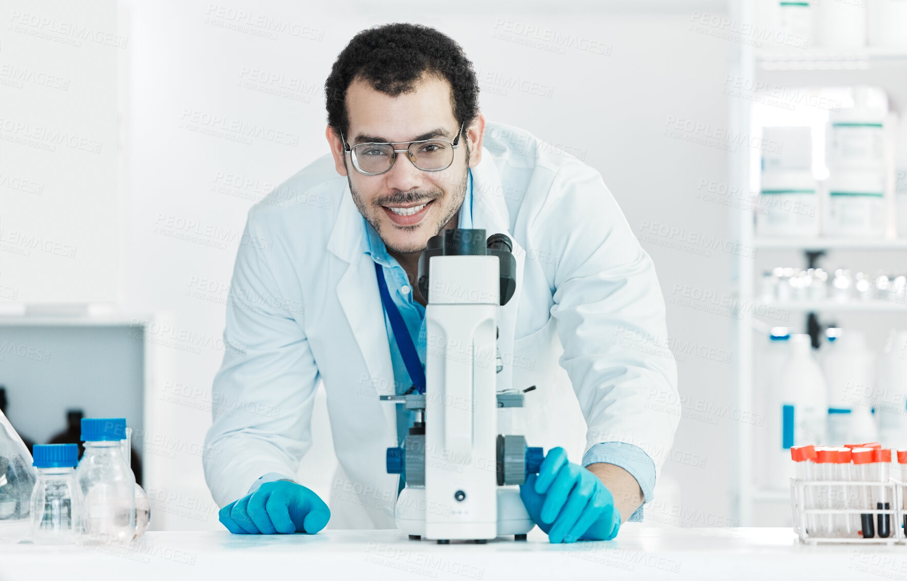 Buy stock photo Microscope, happy man and portrait of scientist in laboratory for science breakthrough, clinical trial or discovery. Biotechnology, medical test or vaccine research with petri dish for cure in Canada