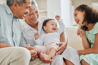 Buy stock photo Happy, sofa and grandparents with baby and child in home for bonding, connection or family time. Smile, love and senior man and woman holding infant with girl kid sibling in living room at house.