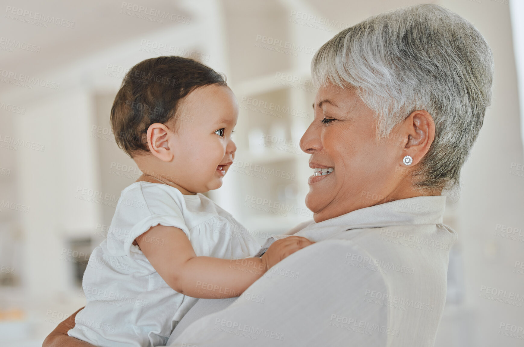 Buy stock photo Baby, grandmother and home with love, smile and support together with generations. Grandparents, care and happy senior woman with newborn and fun in living room with family and cute young girl