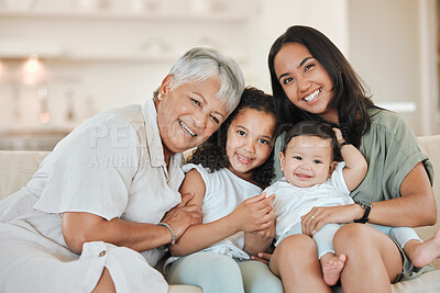 Buy stock photo Shot of a mature woman bonding with her daughter and grandkids on the sofa at home