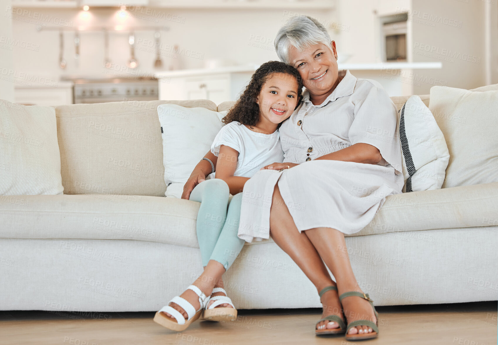 Buy stock photo Happy, relax and portrait of child with grandmother on sofa for bonding, connection or care in home. Smile, love and girl kid resting with senior woman in living room of family house in Mexico.