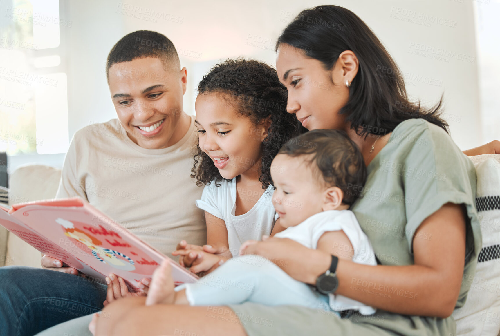 Buy stock photo Shot of a beautiful family bonding on a sofa at home