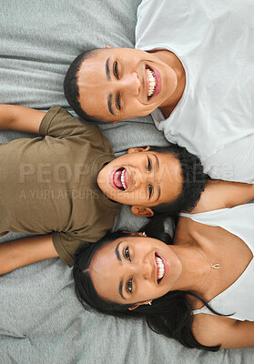 Buy stock photo Happy, relax and portrait of family on bed for bonding, playing and connection at home. Smile, love and boy with mother and father for resting in bedroom together for security in house from above.