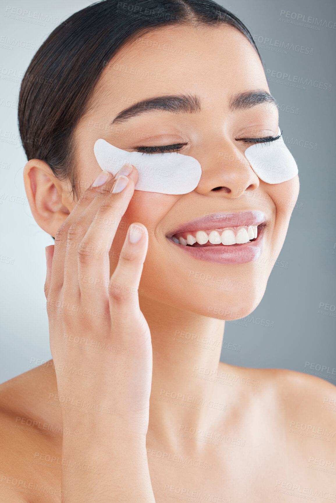 Buy stock photo Studio, skincare and woman with eye mask for cosmetics, skin glow and facial beauty with collagen. Dermatology, female person and eyes with patch for dark circles and spa aesthetic by grey background